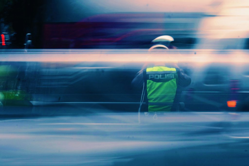 Artistic image of a police officer directing traffic in Jakarta, representing viral traffic cop content and everyday road enforcement in Indonesia.